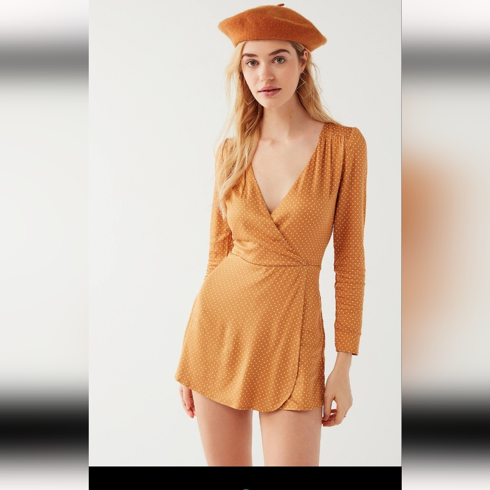 Polka dot romper in Golden | UO